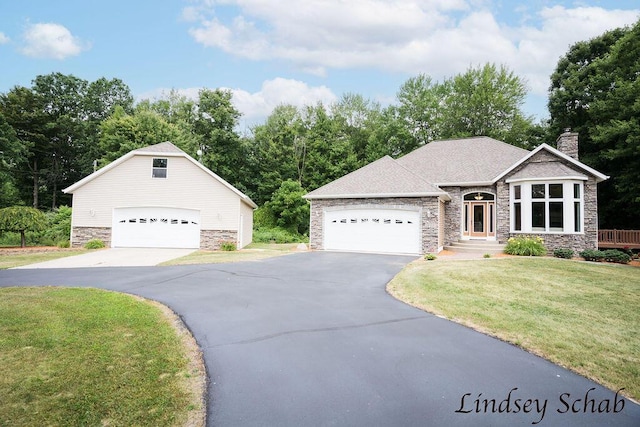 13025 Shaner Ave NE, Cedar Springs, MI 49319 - view of front facade with stone siding, a chimney, a front lawn, and view of wooded area