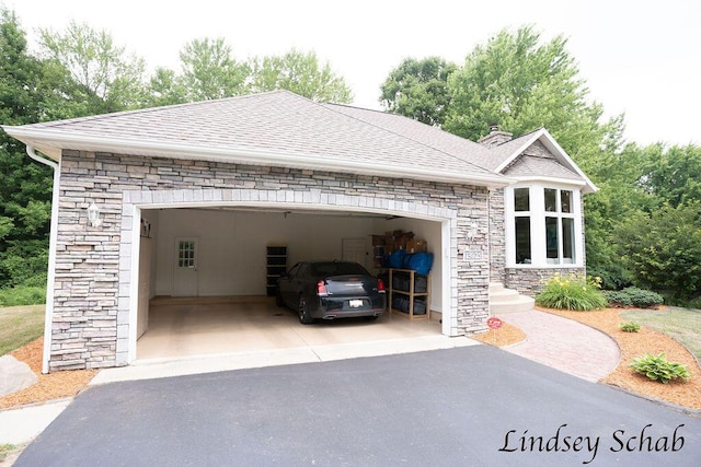 13025 Shaner Ave NE, Cedar Springs, MI 49319 - garage featuring asphalt driveway