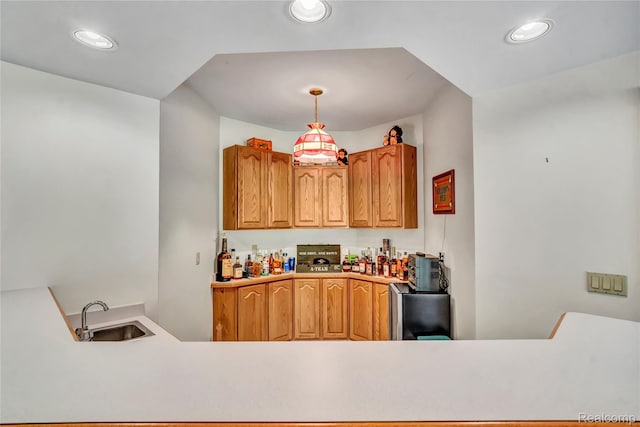 6728 Bowers Rd, Imlay City, MI 48444 - kitchen featuring recessed lighting, pendant lighting, light countertops, brown cabinetry, and a peninsula
