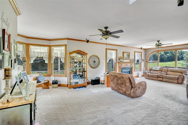 6728 Bowers Rd, Imlay City, MI 48444 - living area featuring carpet, ceiling fan, a glass covered fireplace, and crown molding