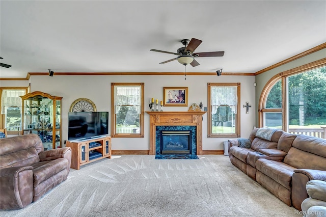 6728 Bowers Rd, Imlay City, MI 48444 - carpeted living room with a ceiling fan, healthy amount of natural light, a high end fireplace, and crown molding