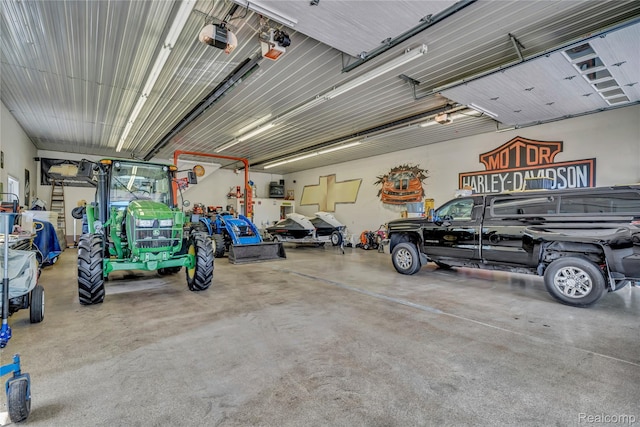 6728 Bowers Rd, Imlay City, MI 48444 - garage featuring a garage door opener
