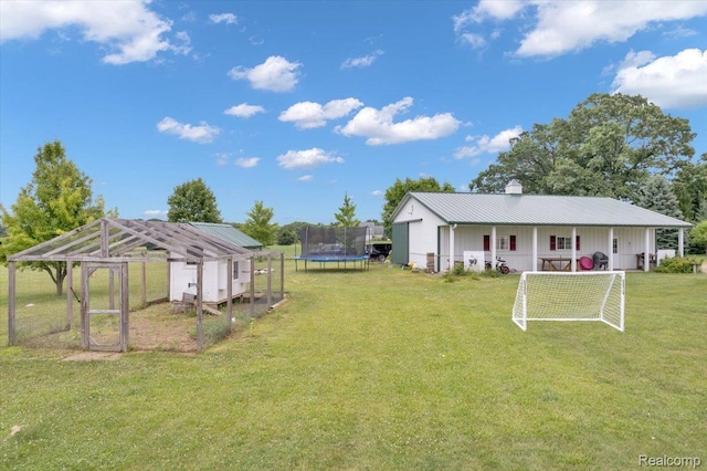 1647 Higley Rd, Lapeer, MI 48446 - view of yard with a trampoline, an outdoor structure, and exterior structure