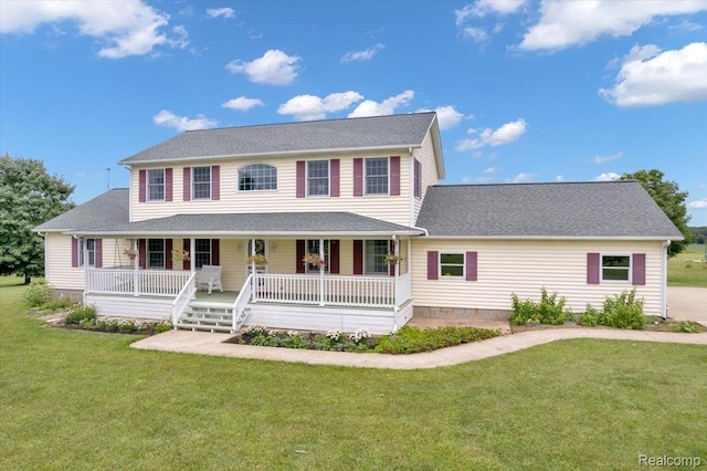1647 Higley Rd, Lapeer, MI 48446 - colonial house with covered porch, a front yard, and roof with shingles
