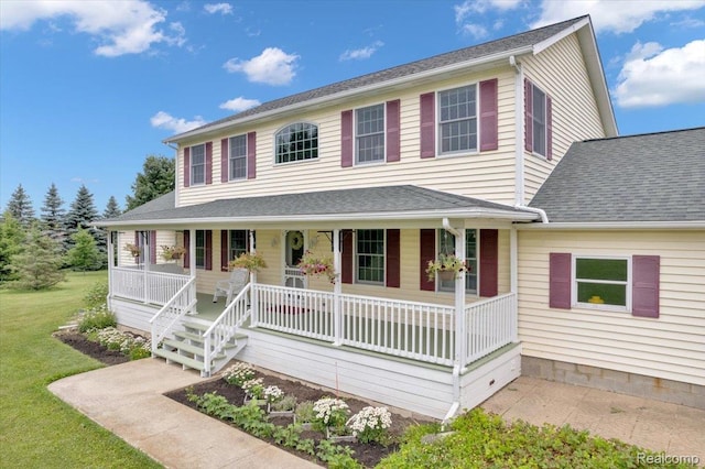 1647 Higley Rd, Lapeer, MI 48446 - view of front of house with covered porch and a front yard