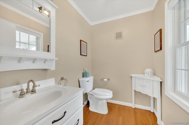 1647 Higley Rd, Lapeer, MI 48446 - bathroom with wood finished floors, ornamental molding, vanity, and plenty of natural light