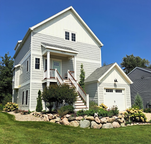 7229 Lakeview Ave, South Haven, MI 49090 - view of front of house featuring board and batten siding, stairway, and a front lawn