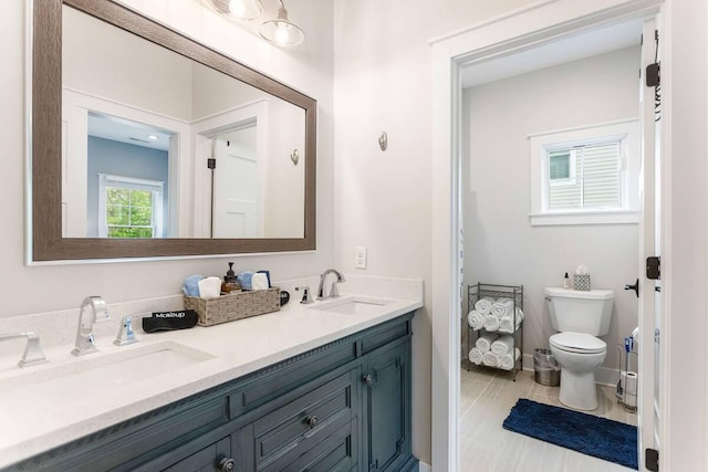 7229 Lakeview Ave, South Haven, MI 49090 - bathroom featuring double vanity and toilet