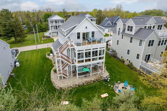 7229 Lakeview Ave, South Haven, MI 49090 - back of property with stairs, a lawn, board and batten siding, and a wooden deck
