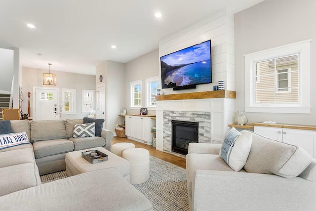 7229 Lakeview Ave, South Haven, MI 49090 - living area featuring light wood-type flooring, a fireplace, recessed lighting, and stairs