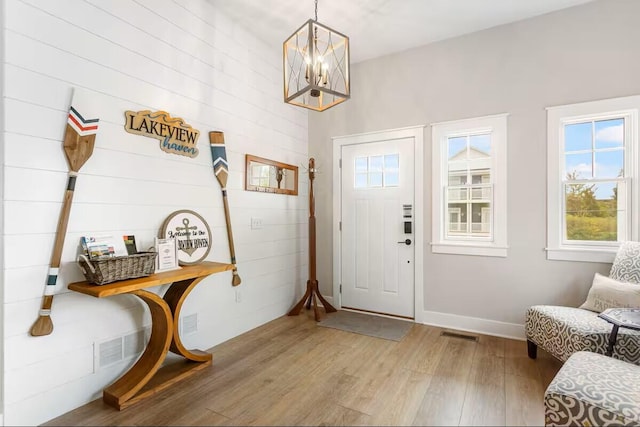 7229 Lakeview Ave, South Haven, MI 49090 - entryway featuring wood finished floors and a chandelier