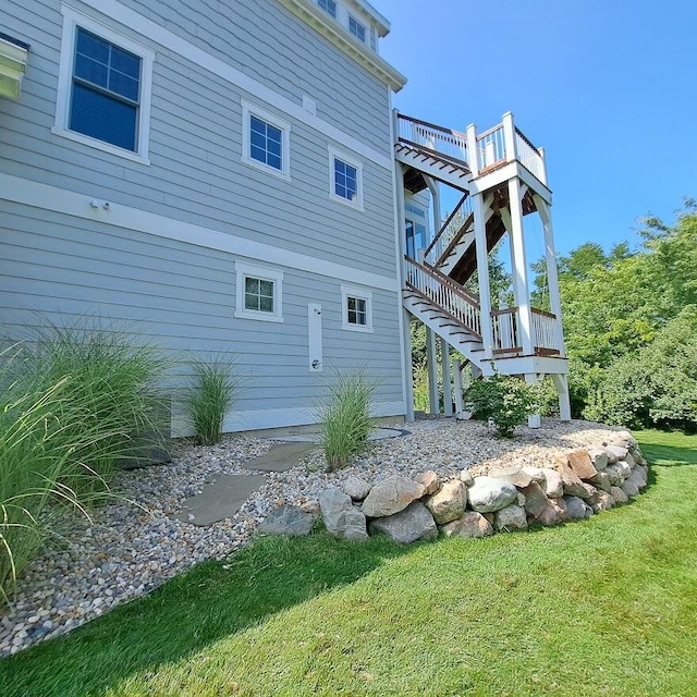 7229 Lakeview Ave, South Haven, MI 49090 - back of house featuring stairs, a deck, and a yard