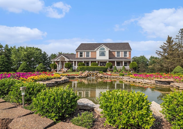 8411 Reese Ln, Ann Arbor, MI 48103 - view of front of home featuring a garden pond