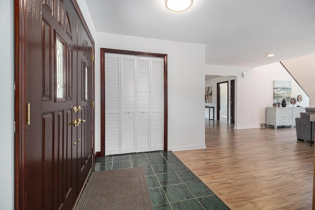 8411 Reese Ln, Ann Arbor, MI 48103 - entryway featuring dark wood finished floors and stairway