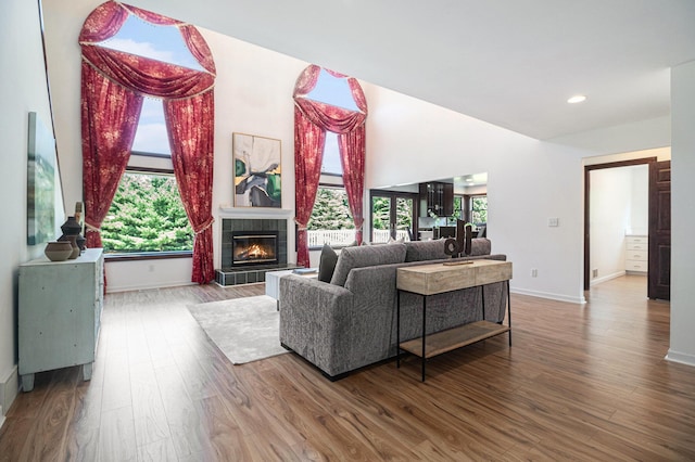 8411 Reese Ln, Ann Arbor, MI 48103 - living room with a tiled fireplace, wood finished floors, and recessed lighting