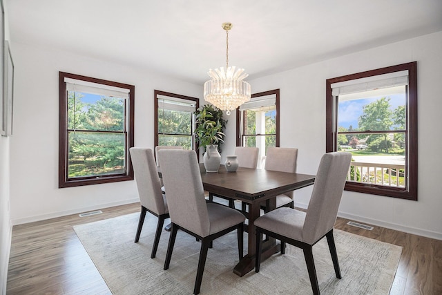 8411 Reese Ln, Ann Arbor, MI 48103 - dining space with a chandelier and light wood-type flooring