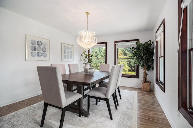 8411 Reese Ln, Ann Arbor, MI 48103 - dining area with a chandelier and wood finished floors