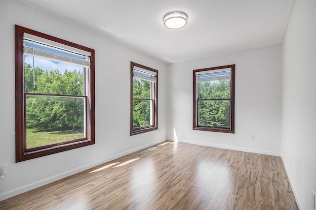 8411 Reese Ln, Ann Arbor, MI 48103 - empty room with wood finished floors and baseboards