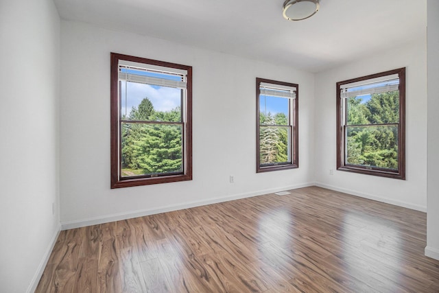 8411 Reese Ln, Ann Arbor, MI 48103 - unfurnished room featuring wood finished floors and baseboards