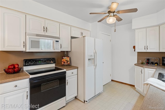 4391 Ashlawn Dr, Flint, MI 48507 - kitchen with white appliances, white cabinetry, ceiling fan, and light countertops