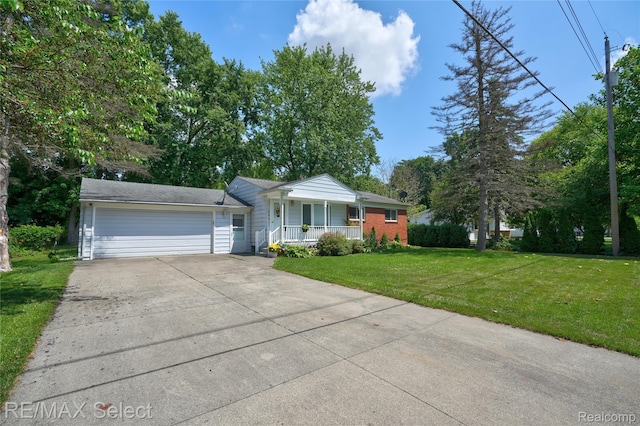 4391 Ashlawn Dr, Flint, MI 48507 - view of front of house featuring covered porch, an attached garage, concrete driveway, a front yard, and brick siding