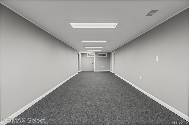 4391 Ashlawn Dr, Flint, MI 48507 - unfurnished room featuring baseboards and dark colored carpet