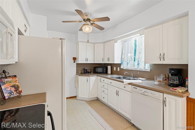 4391 Ashlawn Dr, Flint, MI 48507 - kitchen featuring white appliances, ceiling fan, and white cabinets