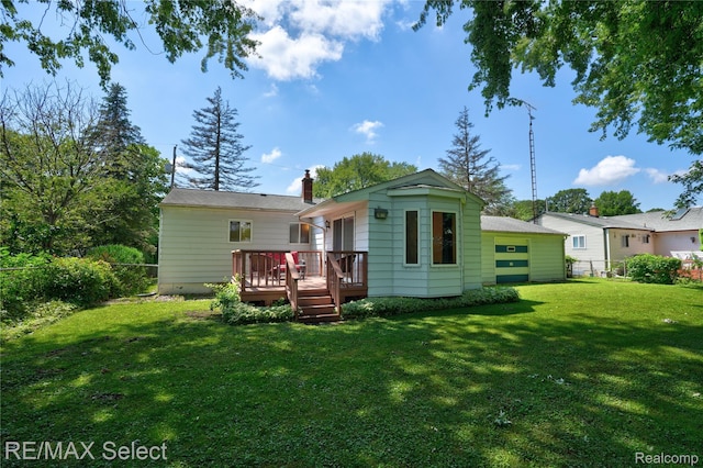 4391 Ashlawn Dr, Flint, MI 48507 - back of house with a wooden deck, a lawn, and a chimney