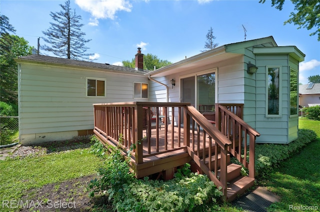 4391 Ashlawn Dr, Flint, MI 48507 - back of house featuring a deck and a chimney