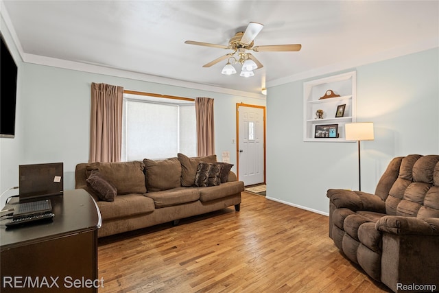4391 Ashlawn Dr, Flint, MI 48507 - living room featuring light wood finished floors, ceiling fan, and built in features