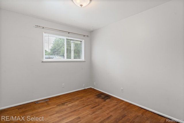 4391 Ashlawn Dr, Flint, MI 48507 - unfurnished room featuring baseboards and wood finished floors