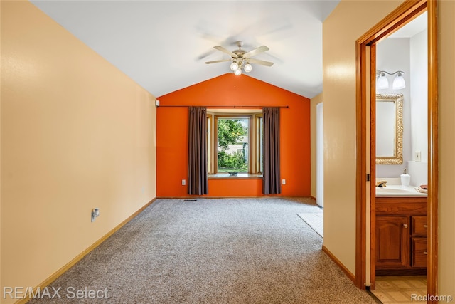 4391 Ashlawn Dr, Flint, MI 48507 - empty room with a ceiling fan, light carpet, and lofted ceiling