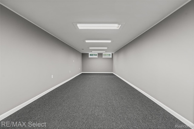4391 Ashlawn Dr, Flint, MI 48507 - unfurnished room with baseboards and dark colored carpet