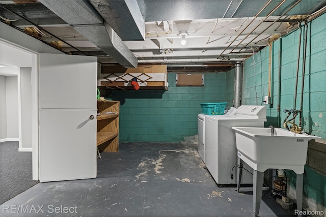 4391 Ashlawn Dr, Flint, MI 48507 - unfinished basement featuring separate washer and dryer and concrete block wall