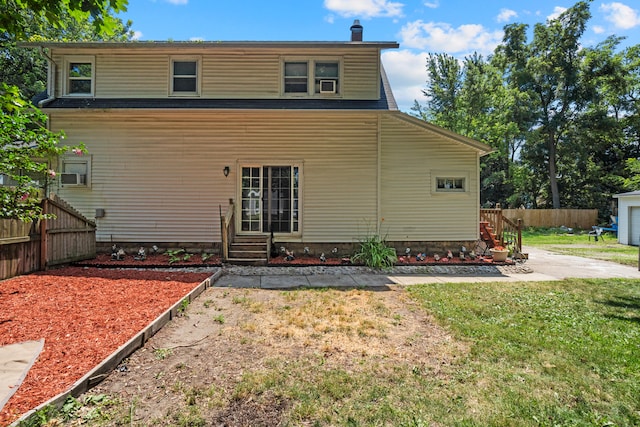 210 S Forbes St, Jackson, MI 49203 - rear view of house with entry steps and a chimney