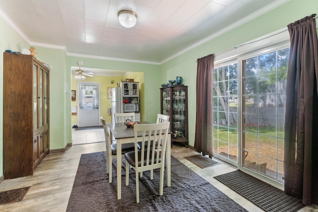 210 S Forbes St, Jackson, MI 49203 - dining space featuring crown molding, light wood-type flooring, and ceiling fan