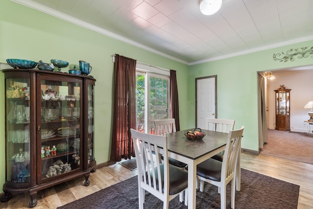 210 S Forbes St, Jackson, MI 49203 - dining room featuring ornamental molding and light wood-type flooring