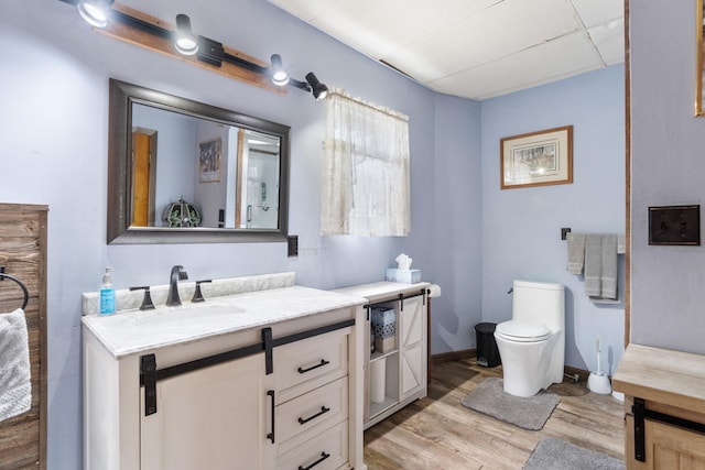 210 S Forbes St, Jackson, MI 49203 - bathroom with vanity and wood finished floors