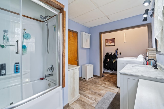 210 S Forbes St, Jackson, MI 49203 - full bathroom with vanity, wood finished floors, a drop ceiling, enclosed tub / shower combo, and independent washer and dryer