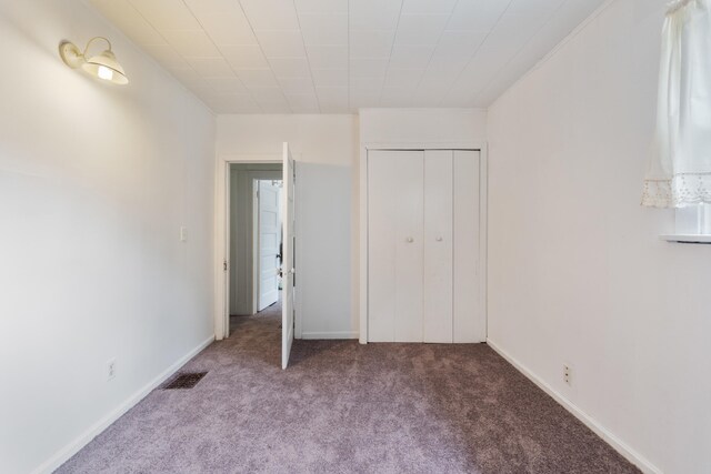 210 S Forbes St, Jackson, MI 49203 - unfurnished bedroom with carpet flooring and a closet