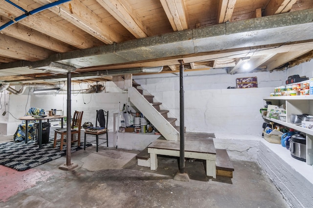 210 S Forbes St, Jackson, MI 49203 - unfinished basement featuring stairs and concrete block wall