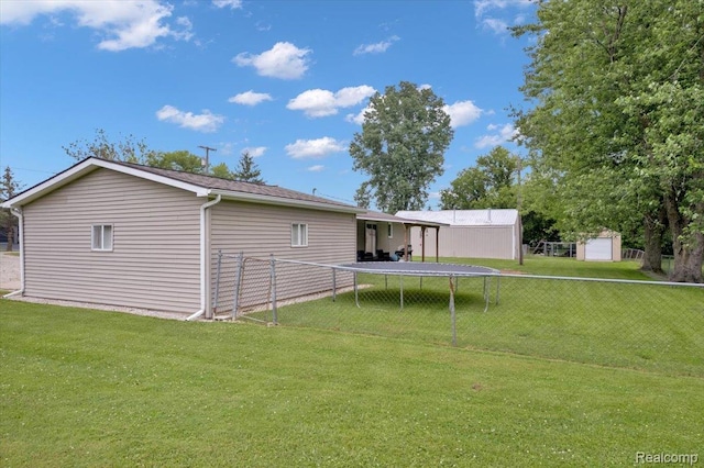 6516 Weyer Rd, Imlay City, MI 48444 - rear view of property with a trampoline