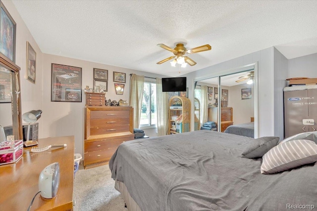 6516 Weyer Rd, Imlay City, MI 48444 - bedroom with a closet, a textured ceiling, ceiling fan, and carpet floors