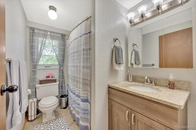 6516 Weyer Rd, Imlay City, MI 48444 - bathroom featuring vanity, a textured wall, and tile patterned floors
