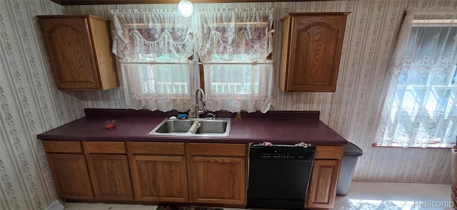 19270 W Brant Rd, Brant, MI 48614 - kitchen featuring black dishwasher, wallpapered walls, dark countertops, and brown cabinetry