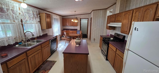 19270 W Brant Rd, Brant, MI 48614 - kitchen featuring freestanding refrigerator, under cabinet range hood, stainless steel gas stove, crown molding, and wallpapered walls