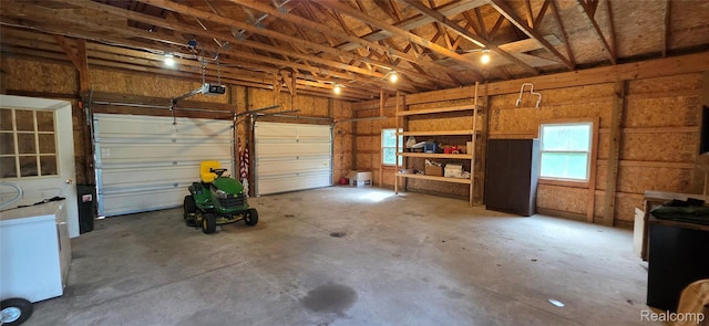 19270 W Brant Rd, Brant, MI 48614 - garage featuring a garage door opener