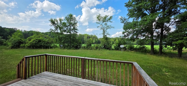 19270 W Brant Rd, Brant, MI 48614 - wooden deck featuring a lawn and a wooded view