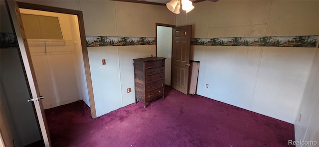 19270 W Brant Rd, Brant, MI 48614 - unfurnished bedroom featuring dark colored carpet and ceiling fan