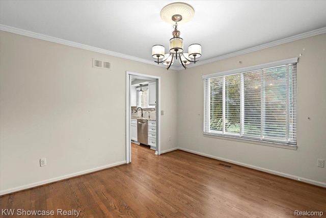 5152 Shenandoah Ct, West Bloomfield, MI 48323 - empty room featuring a chandelier, wood finished floors, and crown molding